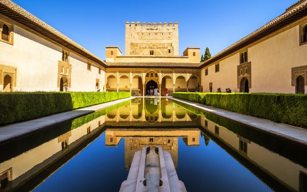 Exquisite exterior view of the Alhambra Palace in Spain, showcasing its timeless beauty and architectural grandeur.